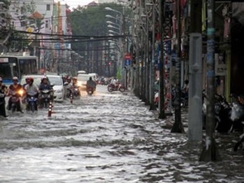 A flooded street after the deluge in HCMC yesterday (Photo: VNA)